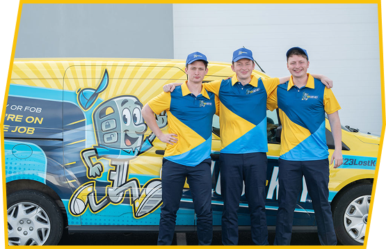 three people standing in front of a work van