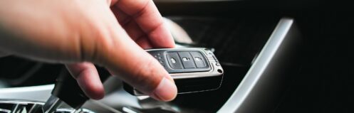Close up of a driver hand holding a car key fob
